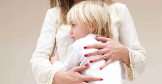 A child hugging their mother