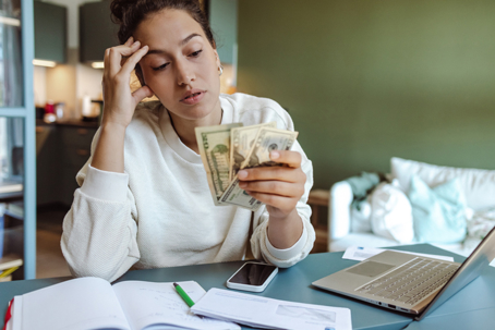 troubled woman counting money