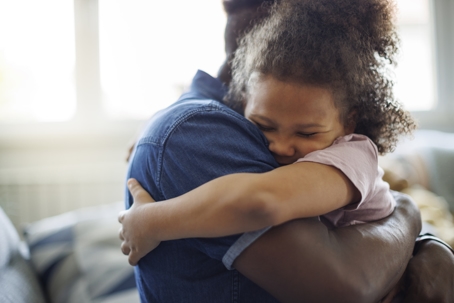 father and daughter hugging