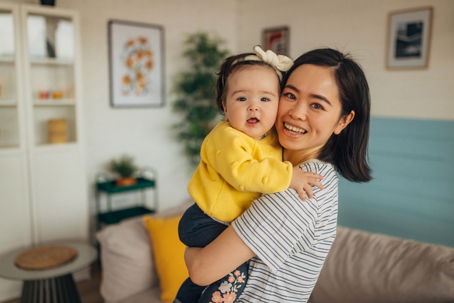 mother holding child in her arms
